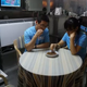 Researchers eating mealworms.